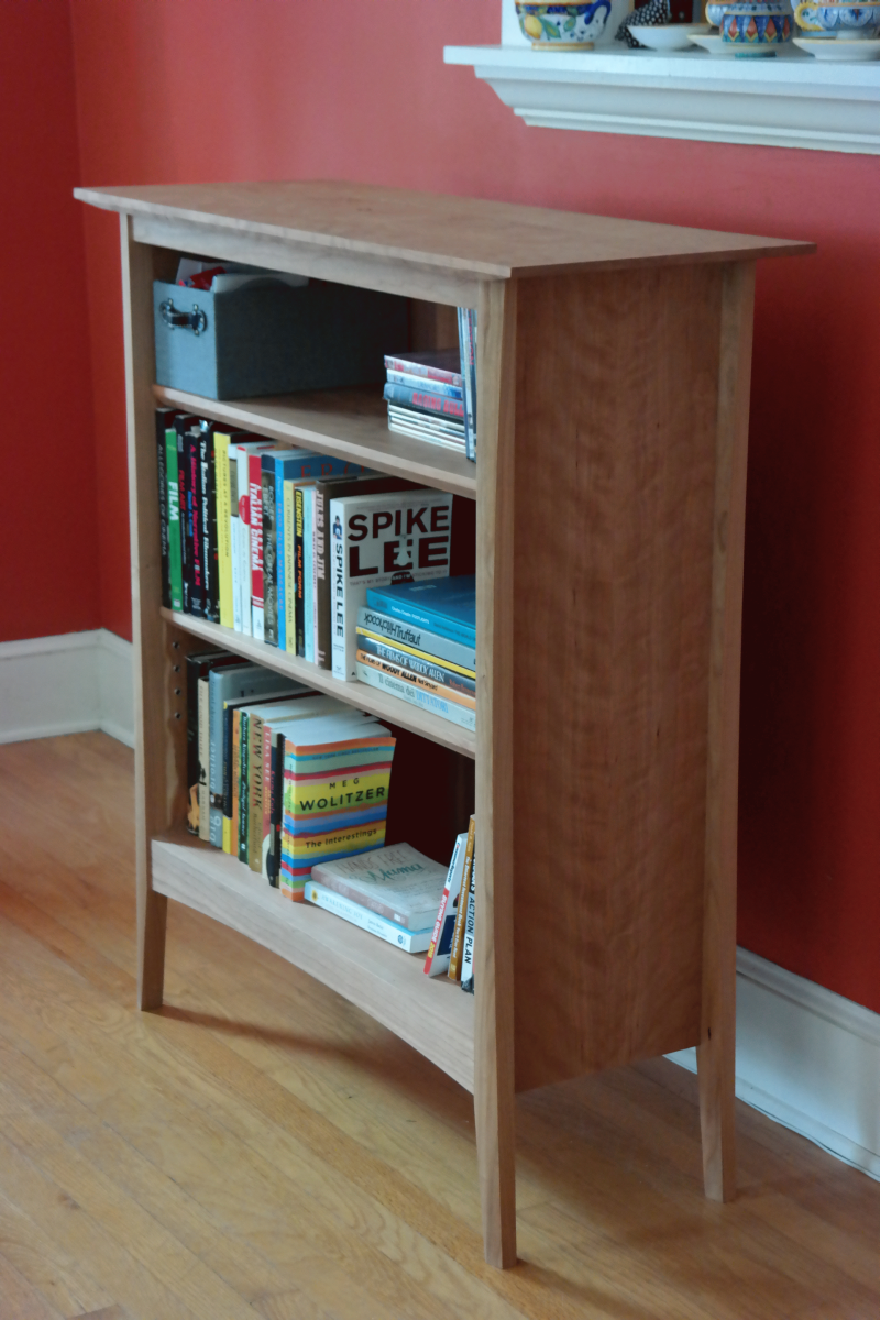 custom handmade bookcase in cherry and pomelle sapele